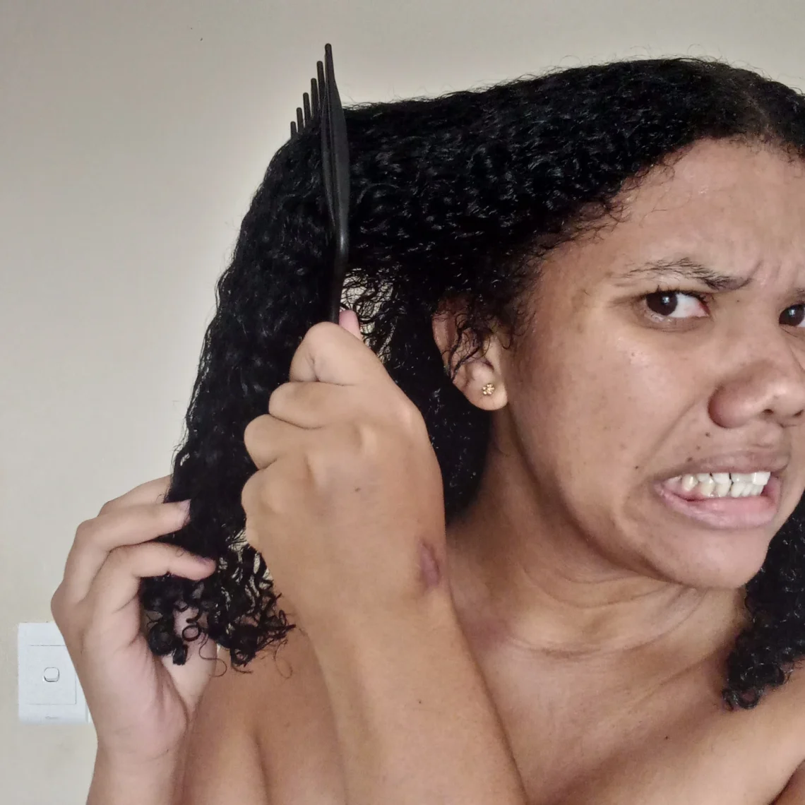 brushing my curly hair that is tangled after I washed it